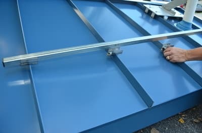 SnoBar rail used as a straightedge to align standing seam clamps
