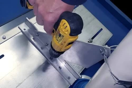 Predrilling and fastening VentSaver base bracket to plate