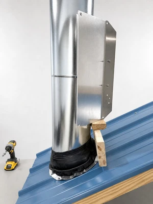 Upper wing kit positioned around chimney pipe