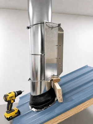 Upper wing kit cables secured around chimney pipe