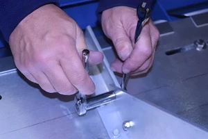 Marking VentSaver base bracket on mounting plate