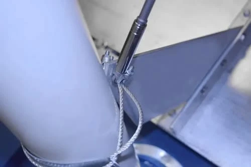 Cable routed around vent pipe through VentSaver fin