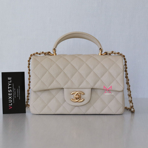 VAN CLEEF 
ARPELS Chanel Classic Mini Rectangular with Top Handle 21S Beige Quilted Caviar with brushed gold hardware 