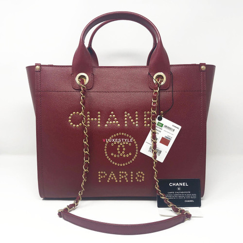 VAN CLEEF 
ARPELS Chanel 18K Studded Burgundy Caviar Leather Deauville 