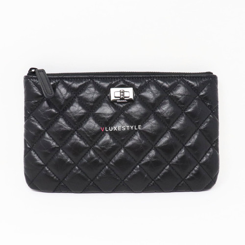 VAN CLEEF 
ARPELS Chanel 19K O Case So Black Reissue Aged Quilted Calfskin with shiny black hardware 