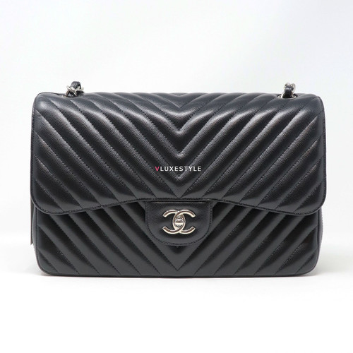 VAN CLEEF 
ARPELS RESERVED: Chanel Classic Jumbo Double Flap 16S Black Chevron Caviar with silver hardware 