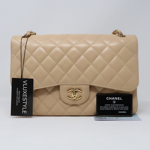 VAN CLEEF 
ARPELS Chanel Classic Jumbo Double Flap Beige Quilted Caviar with gold hardware 