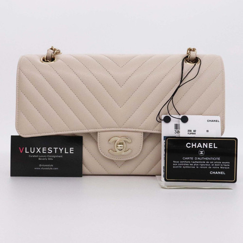 VAN CLEEF 
ARPELS Chanel Classic Medium Double Flap 20B Beige Chevron Caviar with light gold hardware 