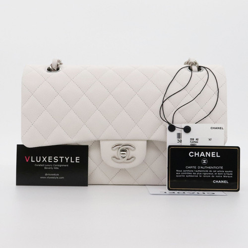 VAN CLEEF 
ARPELS Chanel Classic Medium Double Flap 20B White Quilted Caviar with silver hardware 
