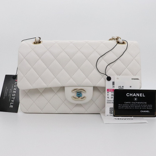VAN CLEEF 
ARPELS Chanel Classic Medium Double Flap 21C White Quilted Caviar with light gold hardware 
