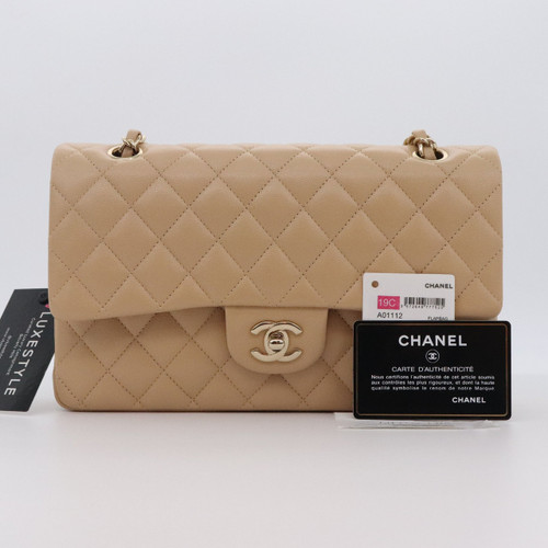VAN CLEEF 
ARPELS Chanel Classic Medium Double Flap 19C Beige Quilted Caviar with light gold hardware 