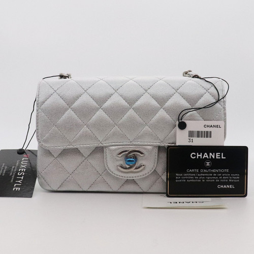 VAN CLEEF 
ARPELS Chanel Classic Mini Rectangular 21P Metallic Silver Grained Lambskin with silver hardware 