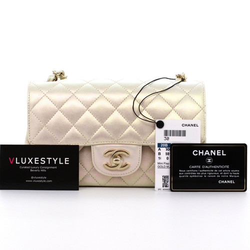 VAN CLEEF 
ARPELS Chanel Classic Mini Rectangular 20B Iridescent Ivory Quilted Lambskin with light gold hardware 