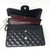 VAN CLEEF 
ARPELS Chanel Classic Black Jumbo Double Flap Caviar with silver hardware 