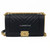 VAN CLEEF 
ARPELS Chanel 18K Le Boy Old Medium Black Chevron Caviar with brushed gold hardware 