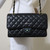 Chanel Classic Medium Double Flap Black Quilted Caviar with gold hardware.