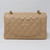 VAN CLEEF 
ARPELS Chanel Classic Small Double Flap Beige Quilted Caviar with gold hardware 