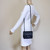 VAN CLEEF 
ARPELS Chanel Classic 17S So Black Mini Square Crumpled Calfskin with shiny black hardware 