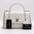 VAN CLEEF 
ARPELS Chanel Coco Handle 20K Iridescent White Quilted Caviar with shiny light gold hardware 