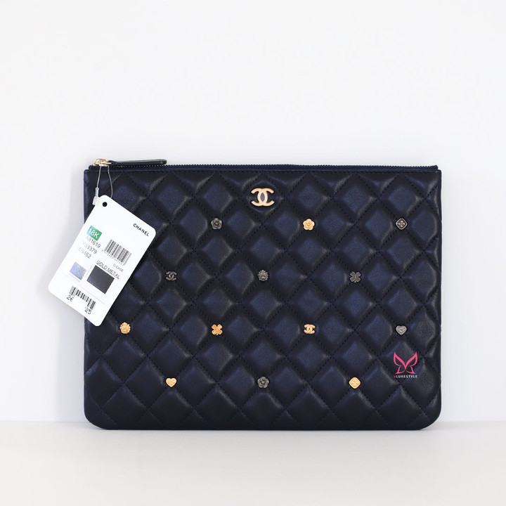 CHANEL Medium O Case 18K Navy Quilted Lambskin Charms 
