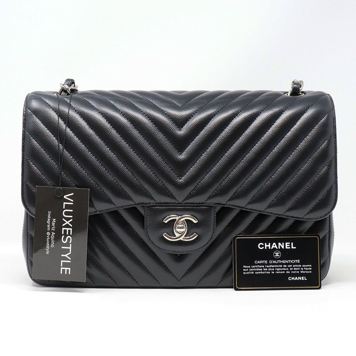 VAN CLEEF 
ARPELS RESERVED: Chanel Classic Jumbo Double Flap 16S Black Chevron Caviar with silver hardware 