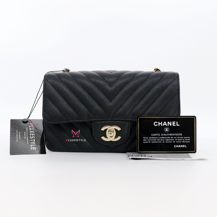 VAN CLEEF 
ARPELS Chanel Classic Mini Rectangular 18B Black Chevron Caviar with light gold hardware 