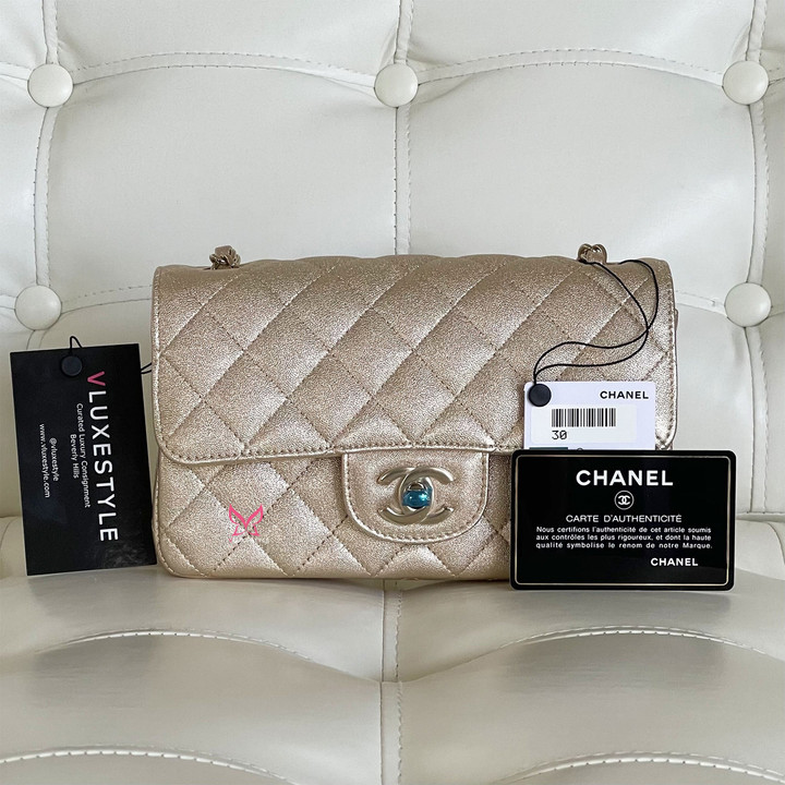 VAN CLEEF 
ARPELS Chanel Classic Mini Rectangular 21P Metallic Gold Grained Quilted Lambskin with light gold hardware 