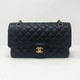 VAN CLEEF 
ARPELS Chanel Classic Medium Double Flap Black Quilted Caviar with gold hardware 