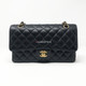 VAN CLEEF 
ARPELS Chanel Classic Black Medium Double Flap Caviar with gold hardware 