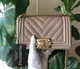 VAN CLEEF & ARPELS Chanel Small Le Boy 18A Iridescent Pearly Beige Chevron Caviar with shiny gold hardware 