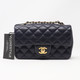 VAN CLEEF 
ARPELS Chanel Classic Mini Rectangular Navy Quilted Caviar with brushed gold hardware 