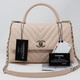 Chanel Coco Handle 20A Beige Chevron Caviar with light gold hardware