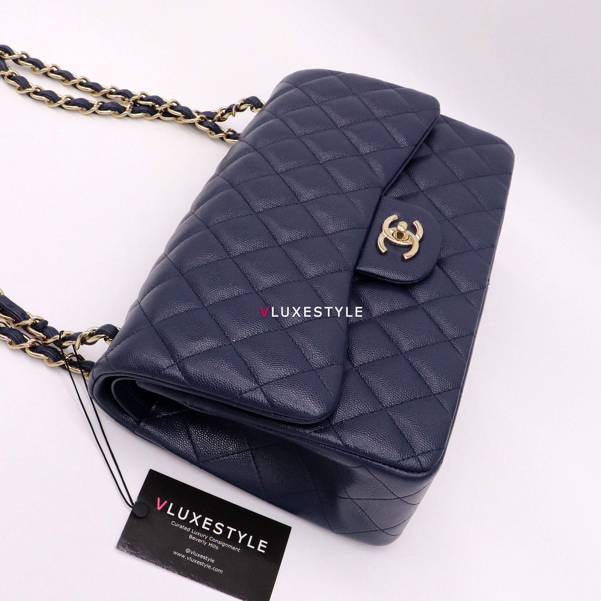 Vintage: Chanel Classic Navy Caviar Leather Jumbo Double Flap with Sil –  The Hangout