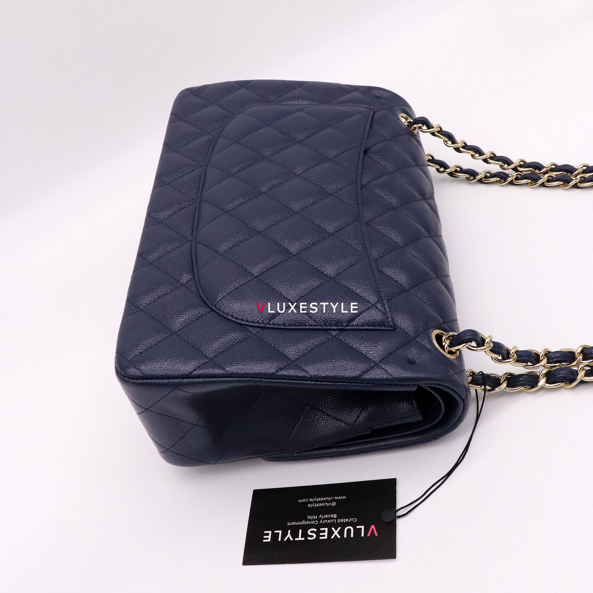 Vintage: Chanel Classic Navy Caviar Leather Jumbo Double Flap with Sil –  The Hangout