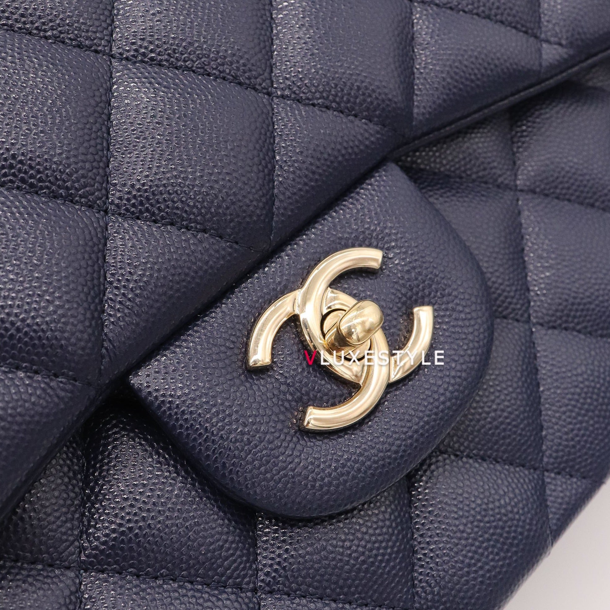 Vintage: Chanel Classic Navy Caviar Leather Jumbo Double Flap with Sil –  The Hangout