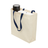 A cream canvas tote bag with navy handles, featuring a gusset, holding a drink bottle and a box inside. A cream canvas tote bag with navy handles, featuring a gusset, holding a drink bottle and a box inside.