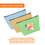Three canvas cosmetic bags in light blue, green, and beige, featuring a logo on the front.