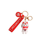 A white and red custom-shaped PVC keyring featuring a cat design, attached to a keychain with a red strap. A white and red custom-shaped PVC keyring featuring a cat design, attached to a keychain with a red strap.
