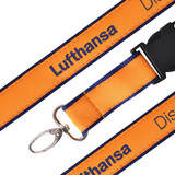 A detailed woven lanyard in orange and navy, featuring a clip and a branding logo.