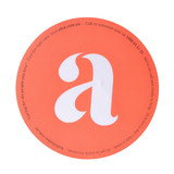 A round orange mouse mat featuring a large white letter 'a' and a small logo. A round orange mouse mat featuring a large white letter 'a' and a small logo.