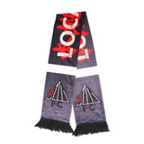 A dark grey velvet scarf with red graphic elements and two black logos, featuring fringed ends.