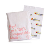 A large white biodegradable mailer bag with a logo and text about compostability.