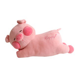 A pink plush pig toy lying down, with 'Happy' embroidered on its side, featuring round glasses and a smiling expression.