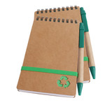 A brown spiral notebook with a green elastic band and two green ballpoint pens, featuring a recycling logo.
