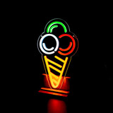 A neon LED sign in the shape of an ice cream cone with red, green, and white colours against a dark background.
