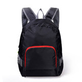 A black backpack with grey straps and a red front pocket, featuring mesh detailing and a logo.