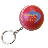 A red cricket ball stress reliever with a keyring attachment, featuring a logo design.