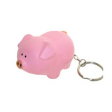 A pink pig-shaped stress reliever attached to a keyring, with a keychain loop for easy attachment.