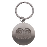 A silver round keychain featuring a logo, attached to a metal ring.