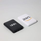 Two powerbanks are displayed, one in black with a logo and the other in white featuring an Amazon logo.